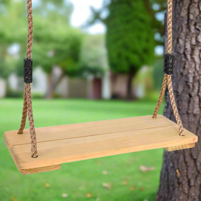 Solid pinewood board swing with adjustable ropes hanging from a tree in a garden