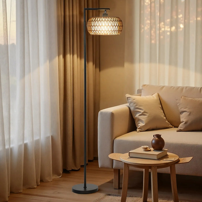 Boho LED floor lamp with woven shade next to beige sofa and wooden table in cozy living room