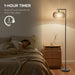 Boho LED floor lamp with remote and 1-hour auto shutoff timer next to bedside table in cozy bedroom