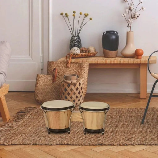 Bongo drum set with natural sheepskin heads on woven rug in cozy living room decor