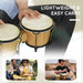 Natural wood bongo drum set with sheepskin heads being played, lightweight and portable