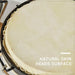 Close-up of natural sheepskin bongo drum head with metal rim and tuning lugs