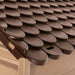 Close-up of brown plastic dog house roof with weather-resistant textured design