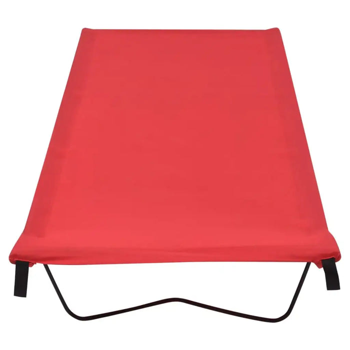 Red portable camping bed with folding steel frame on white background