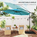 Blue patio umbrella with adjustable angle on a wooden deck with chairs and plants.