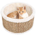 Orange cat in round seagrass and plush cat bed with scratch-resistant beige design