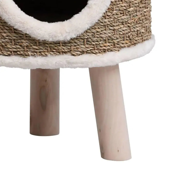 Brown seagrass cat house with wooden legs and plush trim, elevated cat condo design