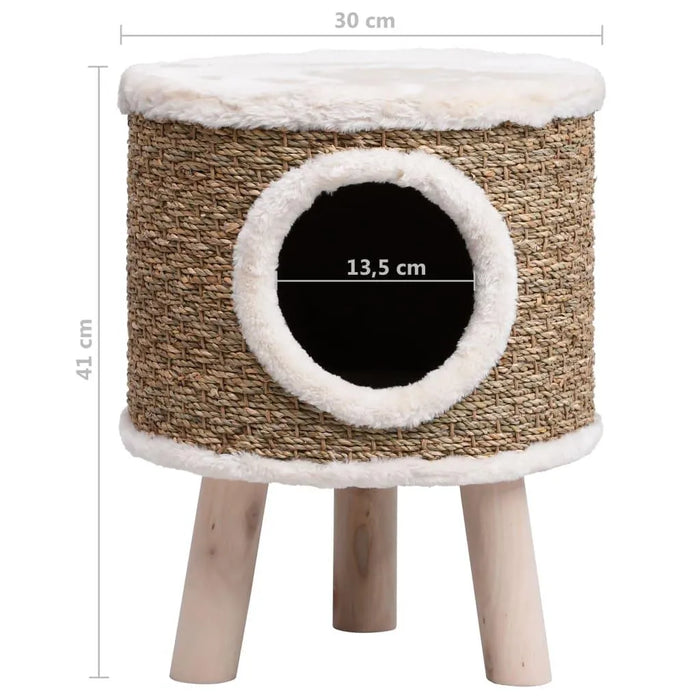 Brown seagrass cat house with white faux fur trim, elevated on wooden legs, round entrance
