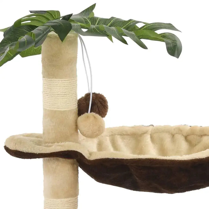 Beige and brown cat tree with sisal scratching post, tropical leaf design, and hanging pompom toys