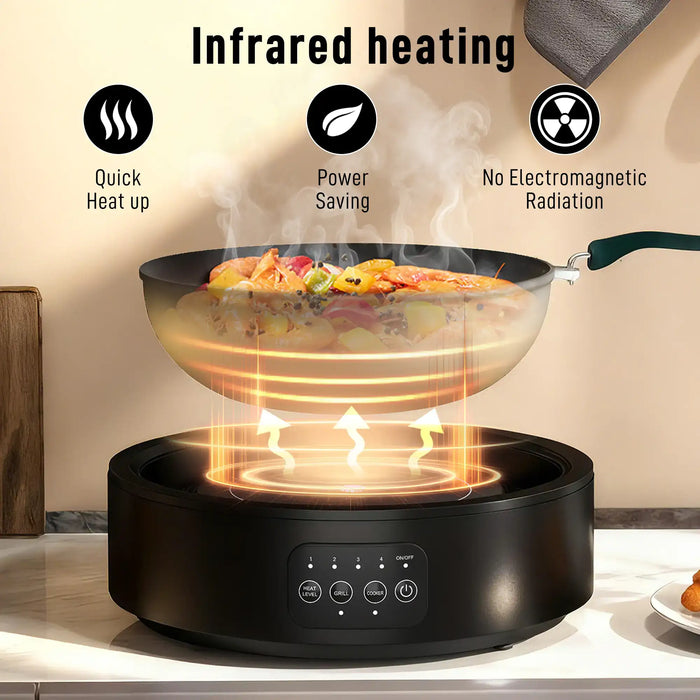 Black ceramic hob and electric grill with infrared heating cooking shrimp and vegetables