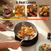 Hands cooking stir fry in frying pan on black electric ceramic hob with four heat levels graphic