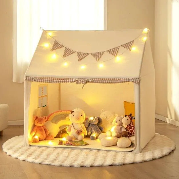 Children's indoor play tent in beige with star lights, flag banner, and plush toys inside.
