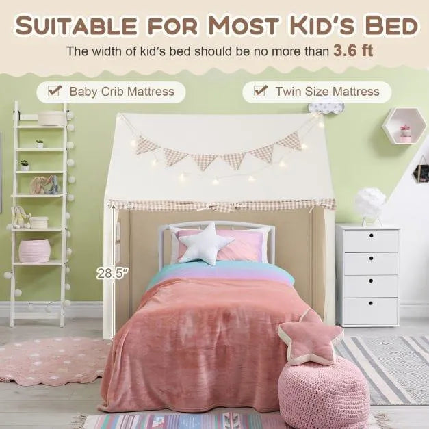 Children's indoor play tent in beige with star lights and flag banner over twin bed