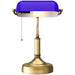 Table lamp with purple shade and brass base on a white background