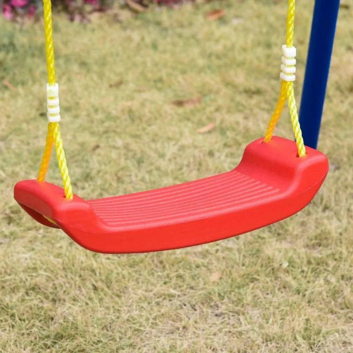 Red plastic kids swing seat with yellow ropes on grassy lawn
