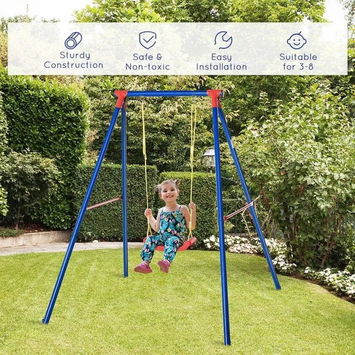 Child on blue metal swing set with U-shaped seat in a green garden, outdoor kids swing toy