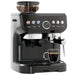 Black espresso machine with a glass of coffee on a white background