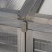 Close-up of grey wood frame and clear polycarbonate panel on cold frame greenhouse