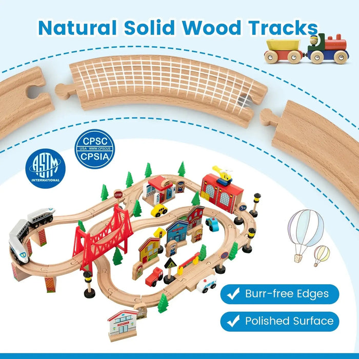 Colorful wooden train table set with tracks, bridge, buildings, cars, and ASTM safety icons.