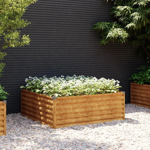 Corten steel raised garden bed with safe edge, filled with plants on pebble ground outdoors