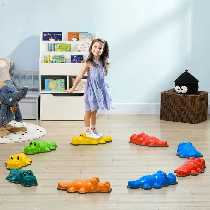 Girl standing on colorful crocodile balance stepping stones for kids in playroom