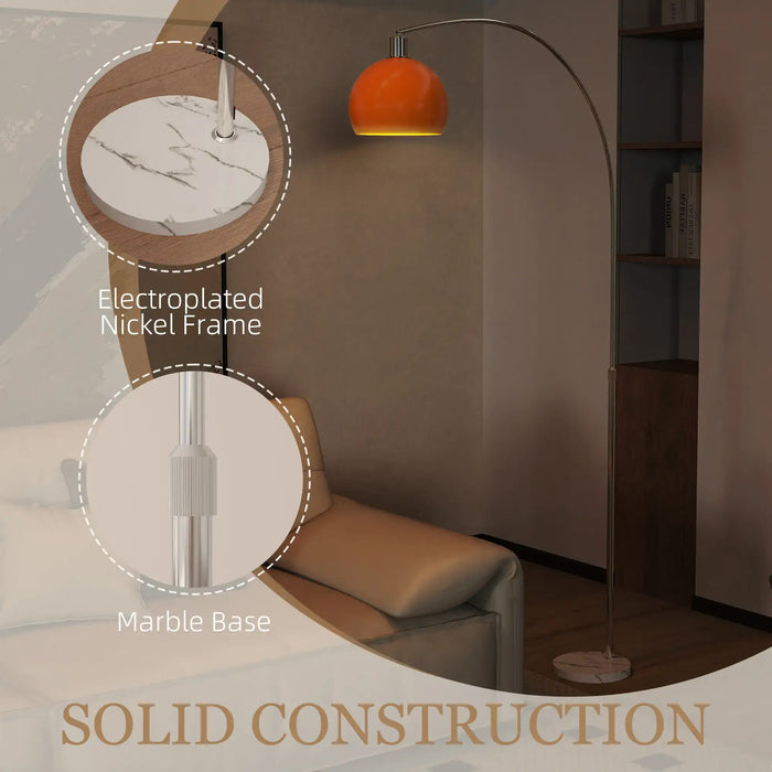 Floor lamp with marble base and electroplated nickel frame in a room setting.