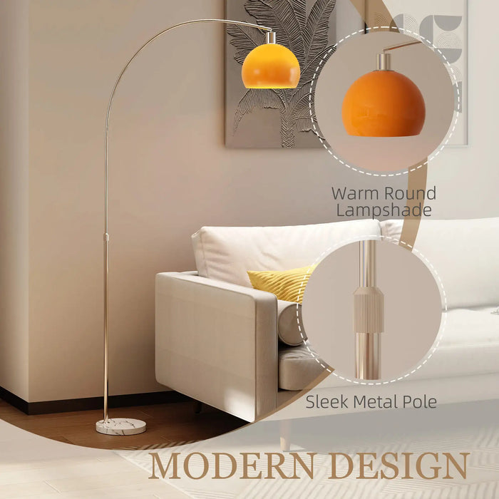 Modern floor lamp with orange lampshade and sleek metal pole in a living room setting.