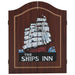 Wood dartboard cabinet with ship graphic and 'The Ships Inn' text on front doors