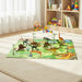 Children's room with a dinosaur-themed play mat and toys on a rug.