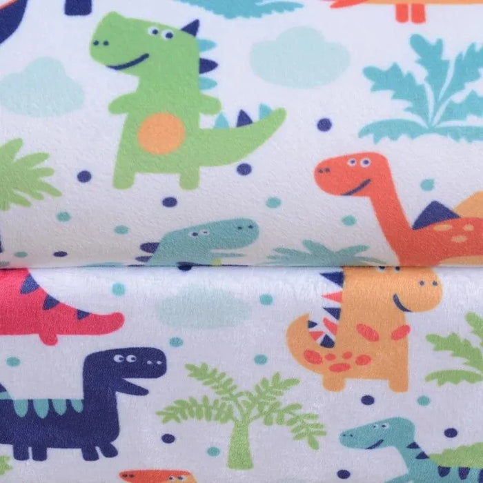 Colorful dinosaur print fabric detail on kids armchair with multicolored cartoon dinosaurs