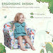 Smiling child sitting on multicolour dinosaur kids armchair with ergonomic design features.