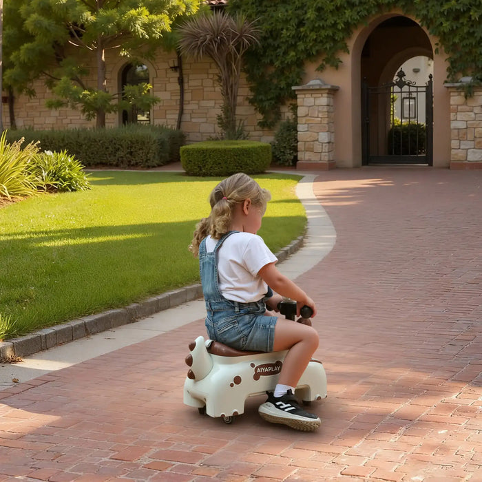 Child riding a toy horse on a brick path with green grass and trees in the background