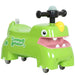 Green children's ride-on toy with a smiling face on a white background