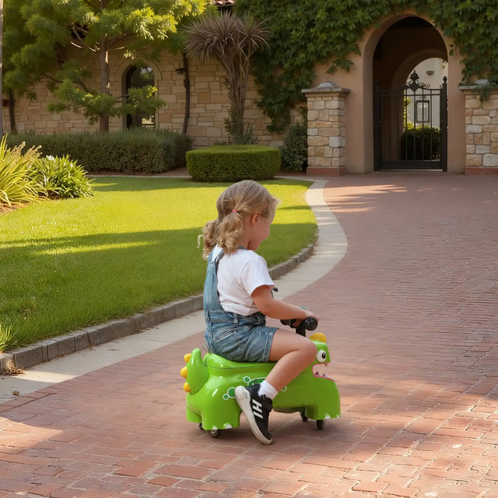 Child riding a green toy car on a brick path with a garden and building in the background