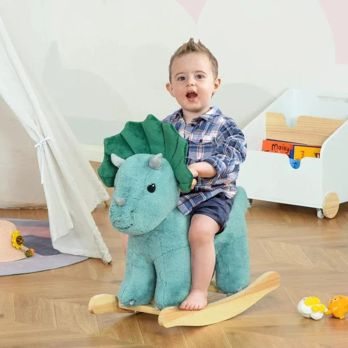Toddler riding dark green triceratops dinosaur rocking horse toy in playroom