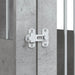 Close-up of concrete grey dog crate furniture with metal latch and bars