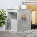 Concrete grey dog crate furniture as end table, books, plant, sofa, and rug in living room