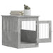 Concrete grey dog crate furniture with open door, books, and plant on top