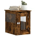 Smoked oak dog crate furniture end table with lockable door, stacked books, and plant decor