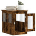 Smoked oak dog crate furniture side table with open lockable door, books, and plant on top