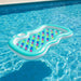 Double inflatable pool lounger with colorful cup holders floating in a clear blue pool