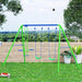 Double swing set with glider, blue and green frame, on grass with trees and fence