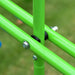 Close-up of green metal swing set frame bolts on grass background.