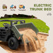 Toy dump truck with electric trunk bed feature, sand being dumped onto a grassy area.