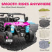 Pink and black toy off-road vehicle with four-wheel shock absorption features on a road surface illustration.