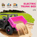Toy dump truck with pink bed dumping sand on a grassy background, featuring icons for load, dump, and transport.