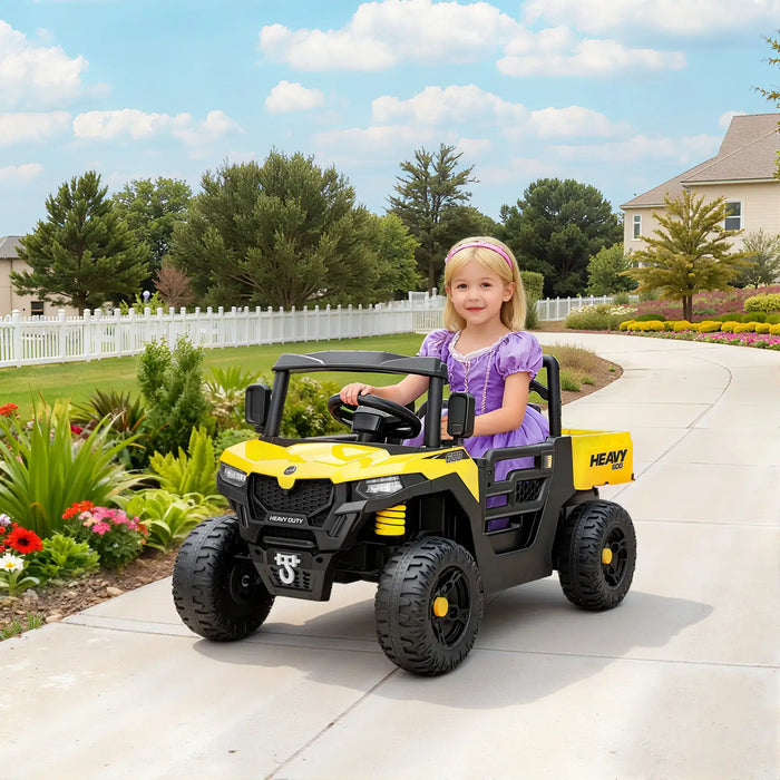 Child in a toy vehicle on a driveway with a garden and house in the background