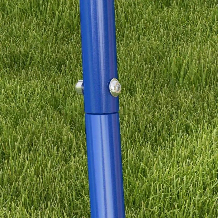 Close-up of blue metal swing frame leg with bolt on green grass