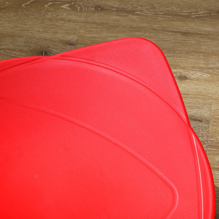 Red cushion on a wooden floor
