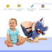Smiling baby with plush blue elephant rocking horse, safe nursery toy for toddlers